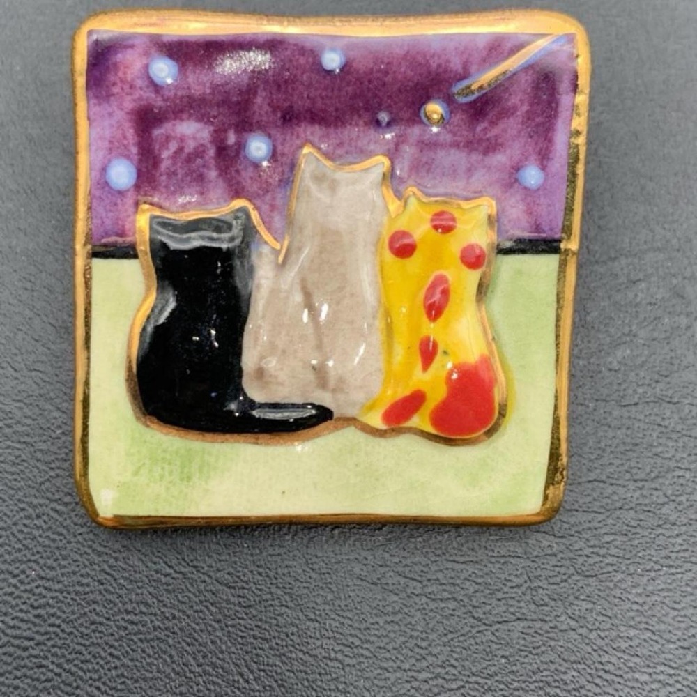 Artisan handmade ceramic brooch with 3 cats looking at the night sky